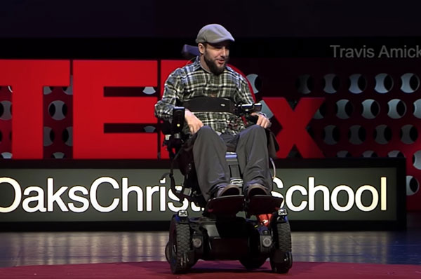 Travis Amick TEDx Talk - Travis in a wheel chair on stage